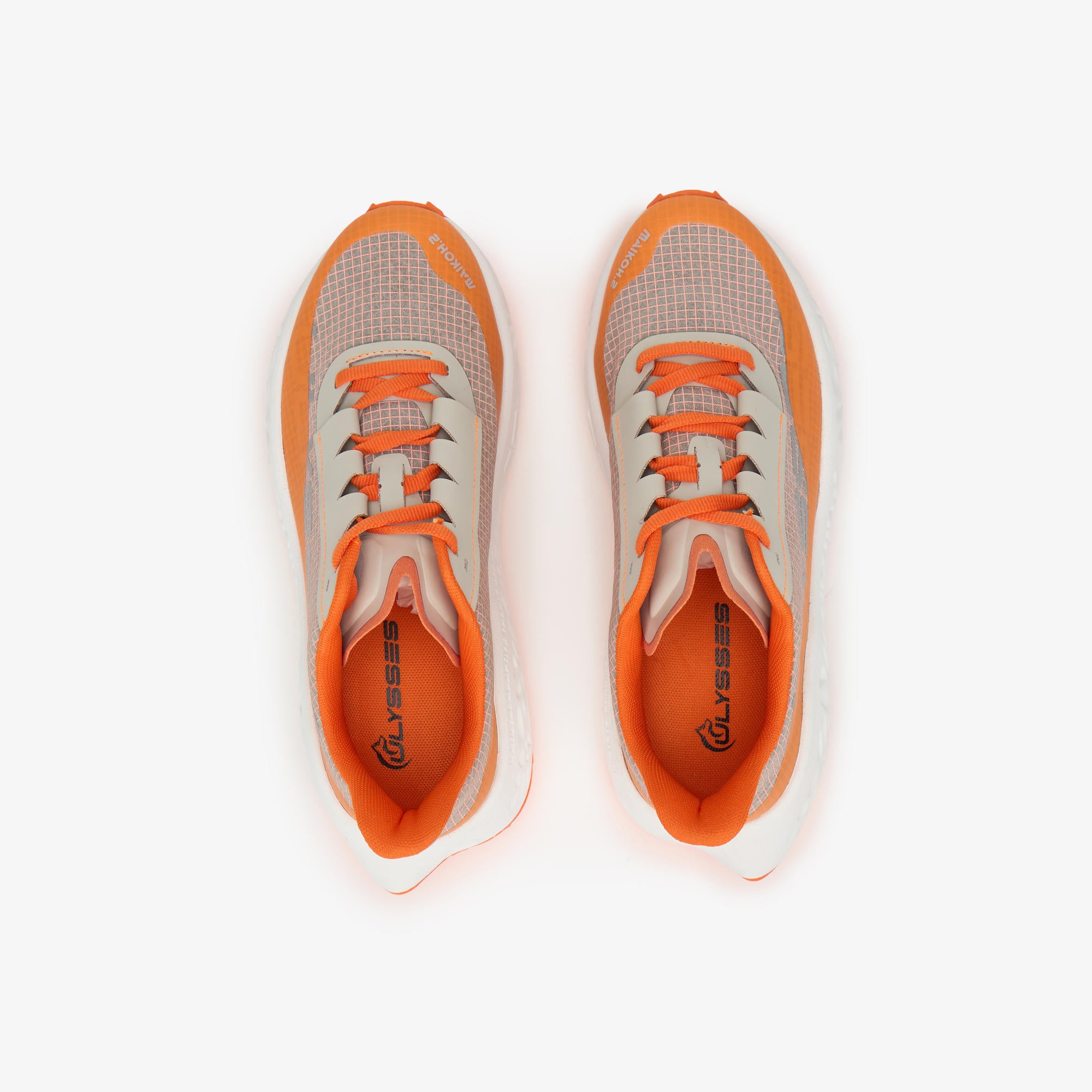 A pair of athletic running shoes shown from a top-down view, featuring a light beige mesh upper with bright orange overlays, laces, and lining.