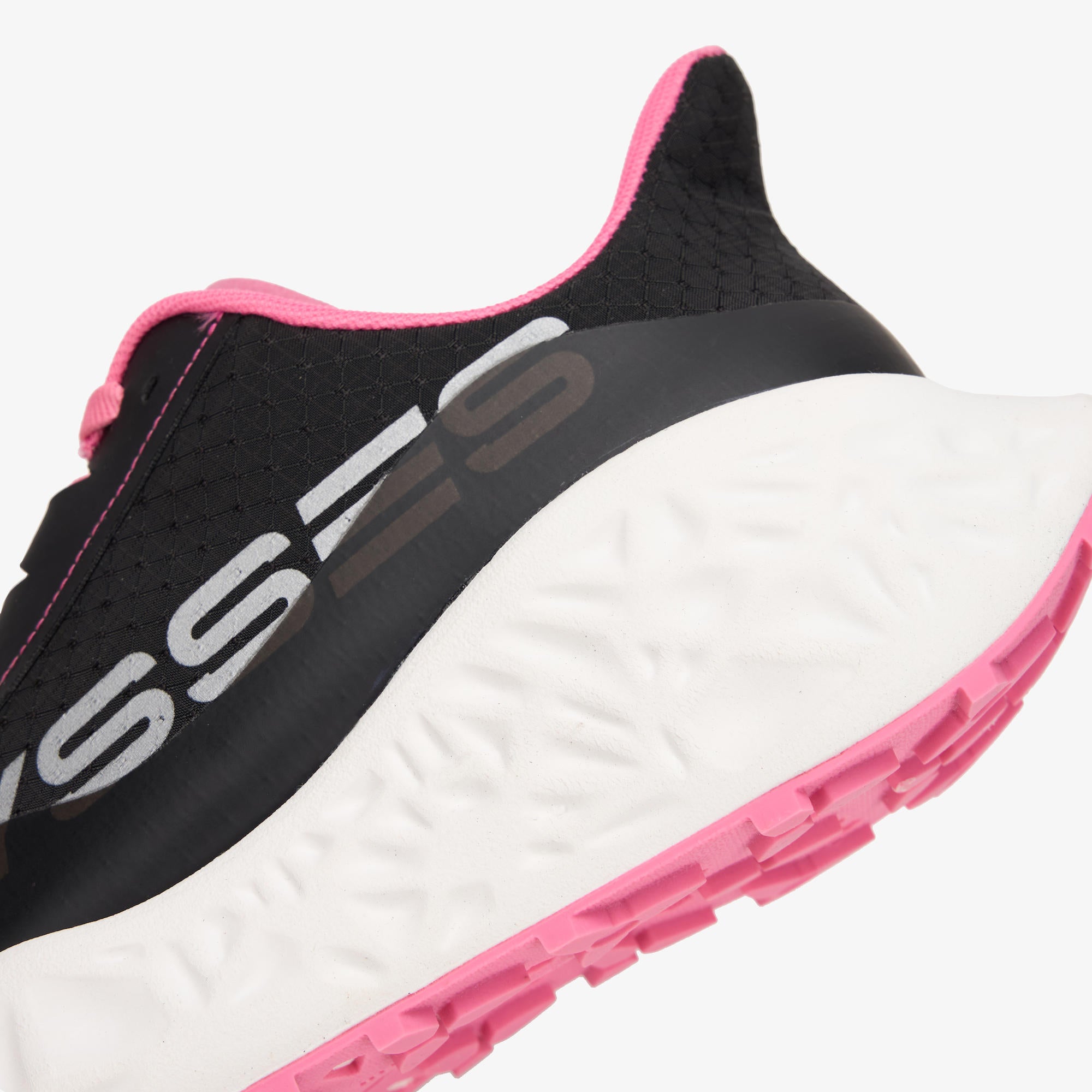 Close-up of a running shoe showing the side profile with a black upper, white midsole, and bright pink accents on the collar, outsole, and logo text.