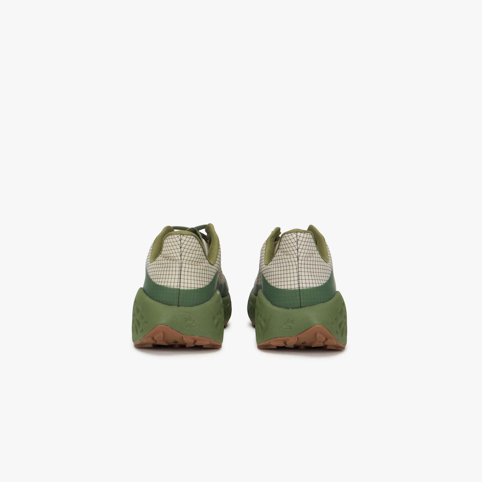 A pair of green ULYSSES MAIKOH shown from the back, featuring olive green soles, a green and white checkered pattern on the upper, and a brown outsole edge, set against a plain light gray background.