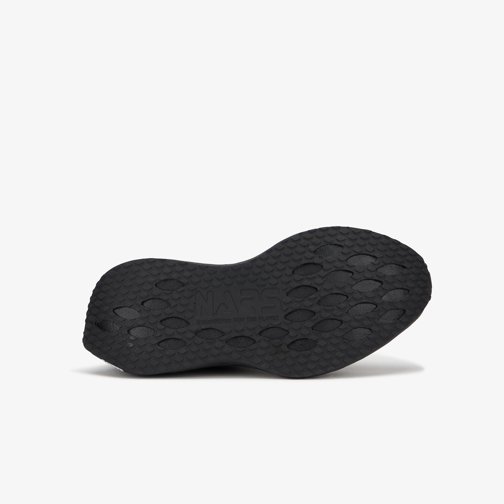 A black athletic shoe sole with a textured, circular tread pattern, shown from a side profile view against a clean white background.