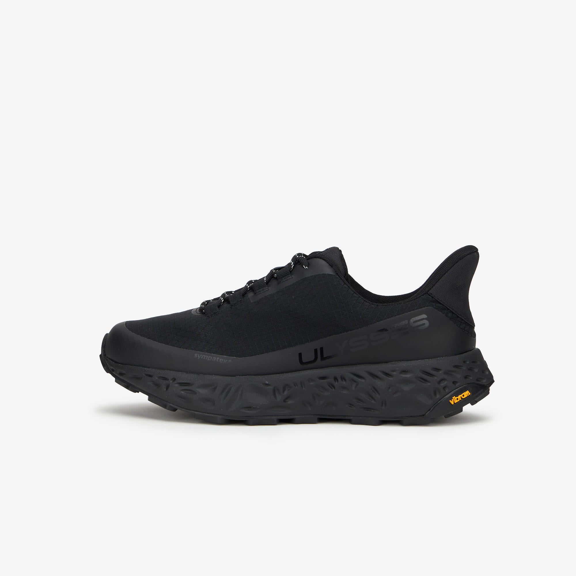 A black trail running shoe shown from the side against a light gray background. The shoe features a textured black sole, a black mesh upper, and a small yellow Vibram logo on the heel.