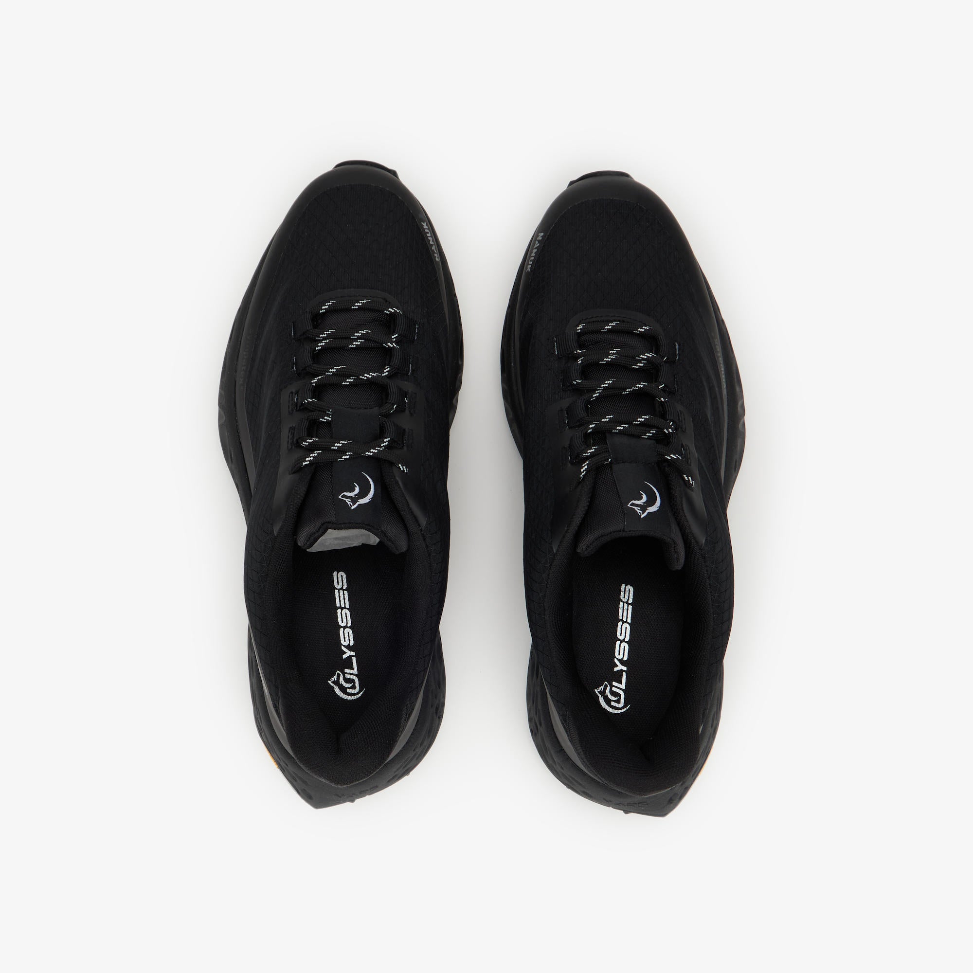 A pair of black athletic sneakers shown from a top-down view on a clean white background. The brand name 'ULYSSES' is printed in white on the insoles.
