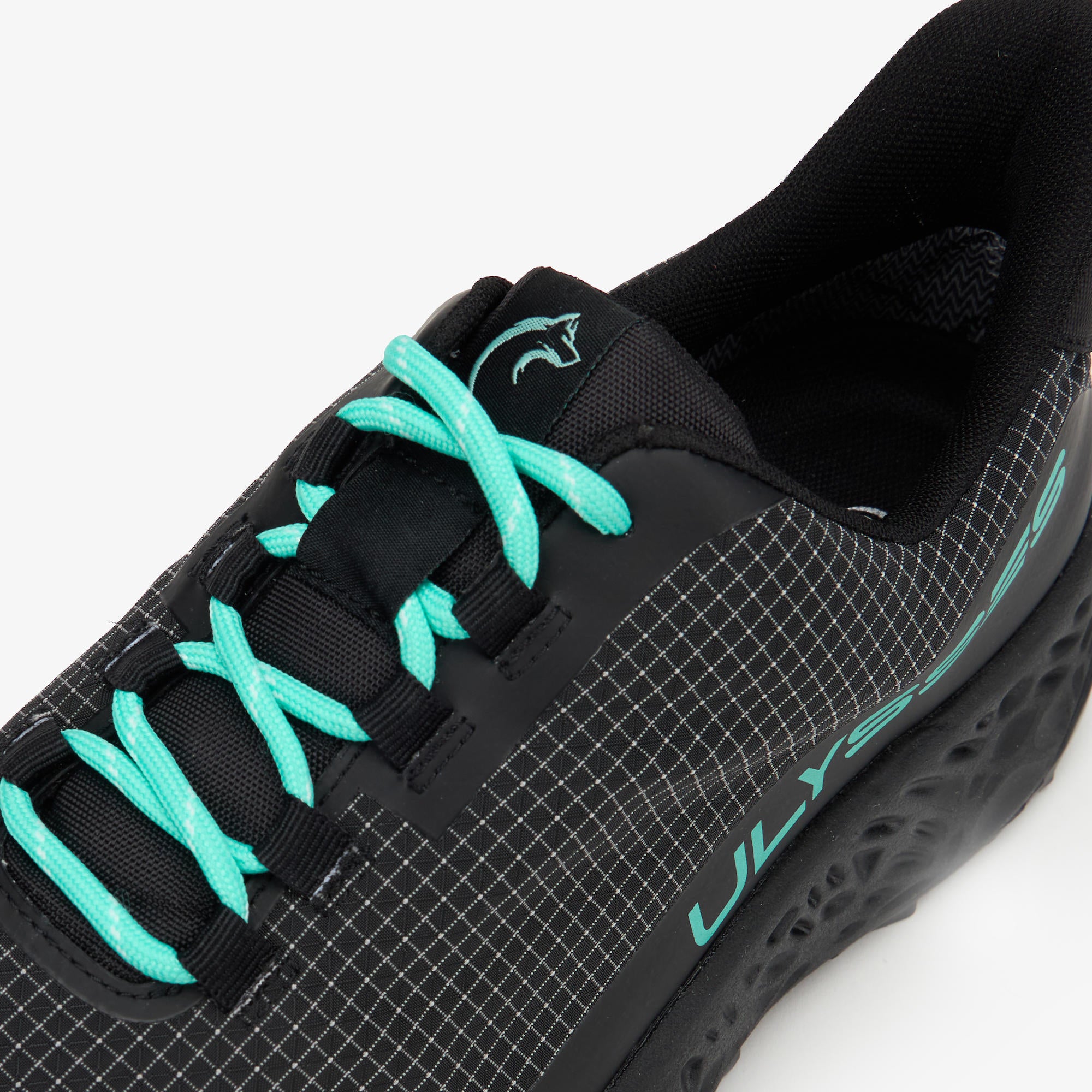 Close-up of a black athletic shoe with bright turquoise laces and turquoise logo lettering on a white background.