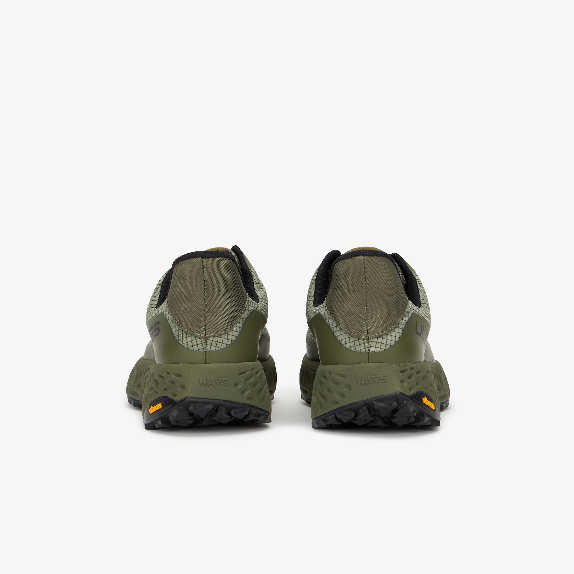 A pair of outdoor trail running shoes shown from the rear, in olive green with black soles and small orange Vibram logos, on a light gray background.