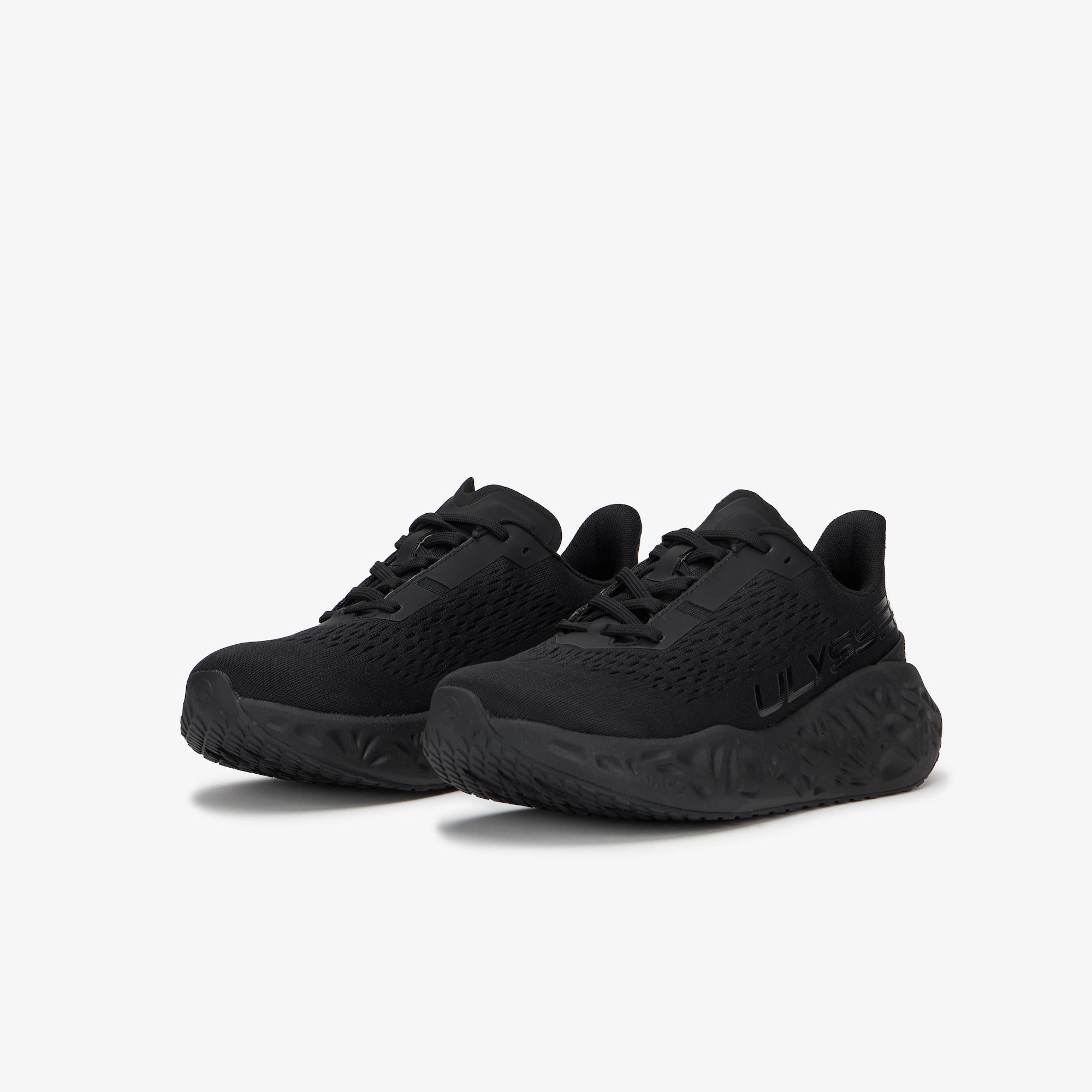 A pair of black WAYA sneakers with textured mesh uppers and chunky sculpted soles, displayed on a clean light gray background.