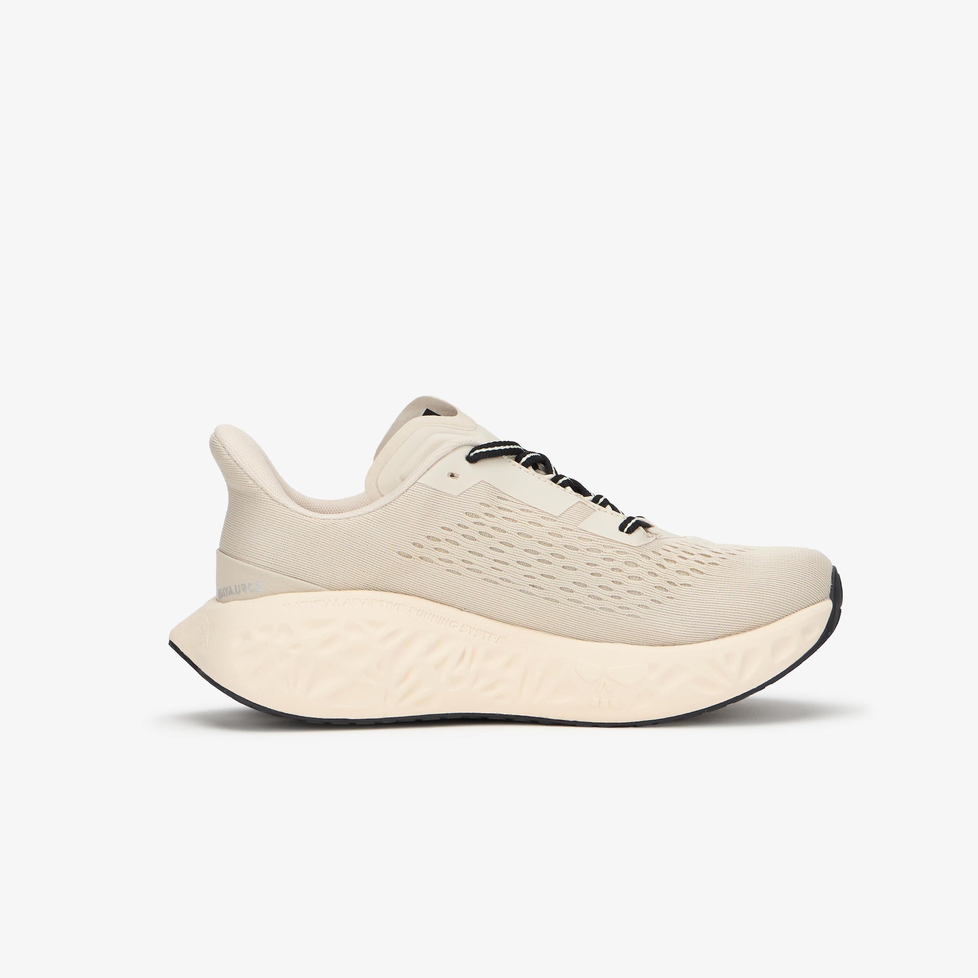 A single light beige athletic sneaker shown in a side profile view against a clean, light gray background.