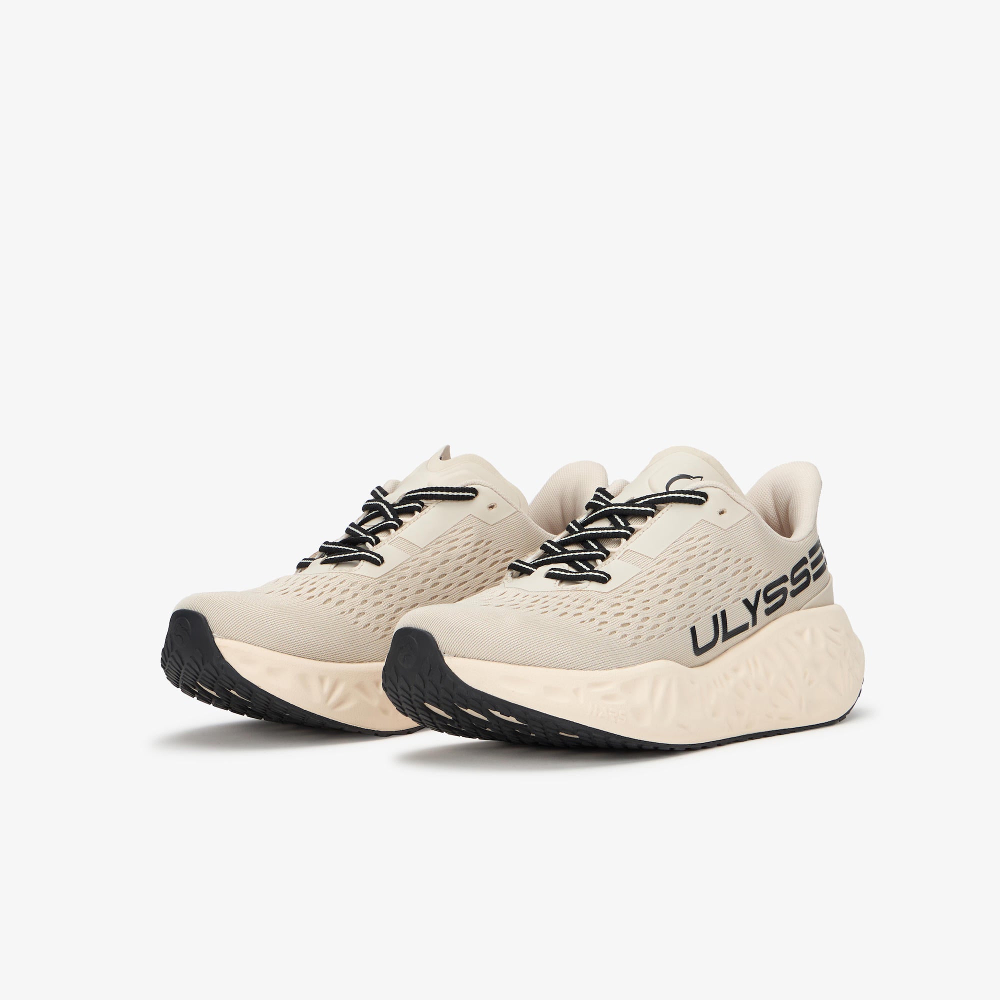A pair of Ulysses running shoes in a light beige/off-white colorway with black laces and black outsole details, shown against a plain light gray background.