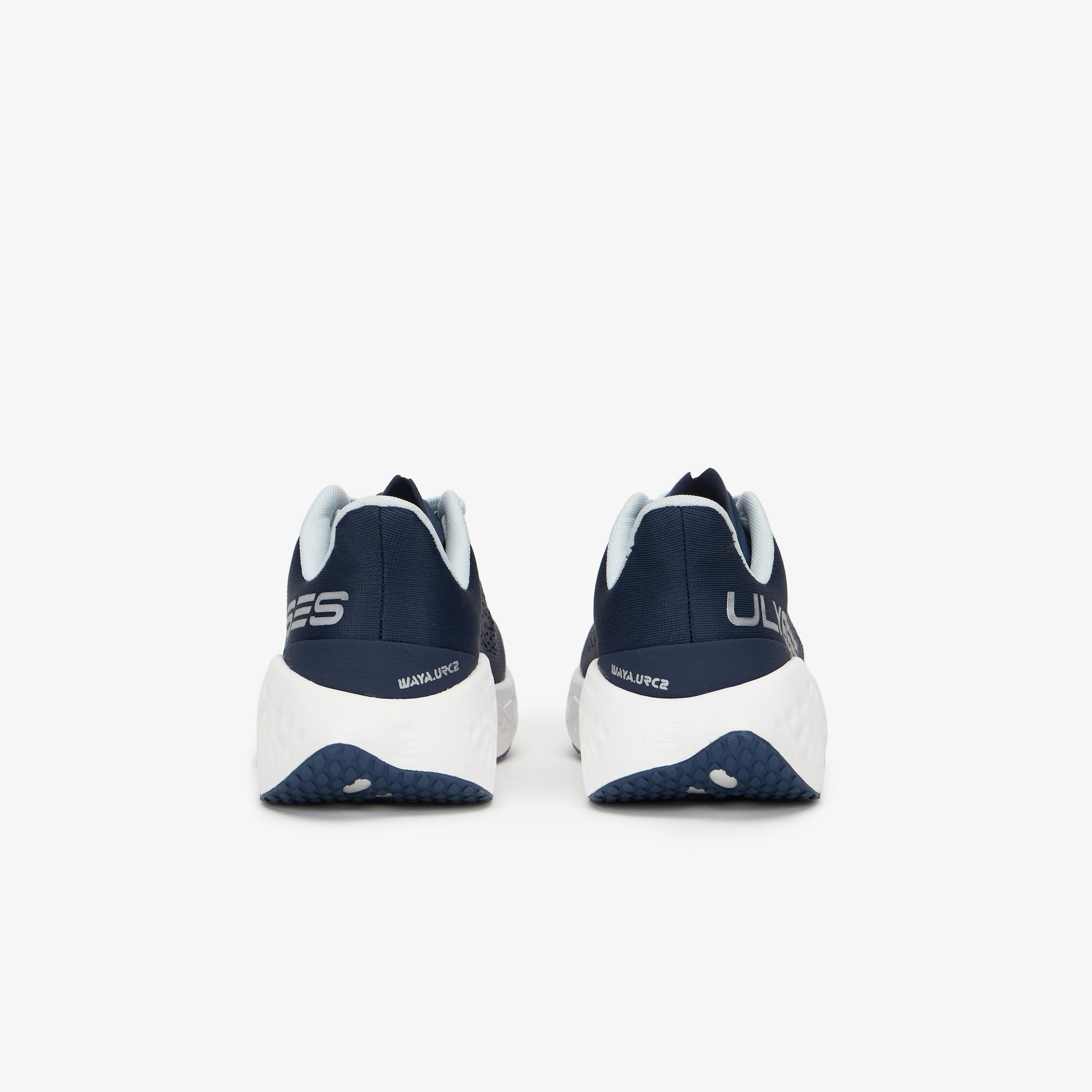 A pair of navy blue and white WAYA sneakers shown from the rear, featuring a thick white midsole