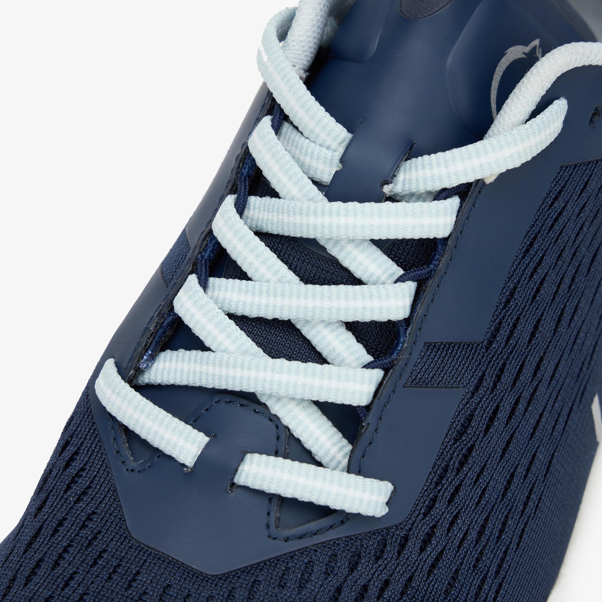 Close-up of a navy blue WAYA shoe with light blue ribbed laces, showing the textured knit upper and lace details against a white background.